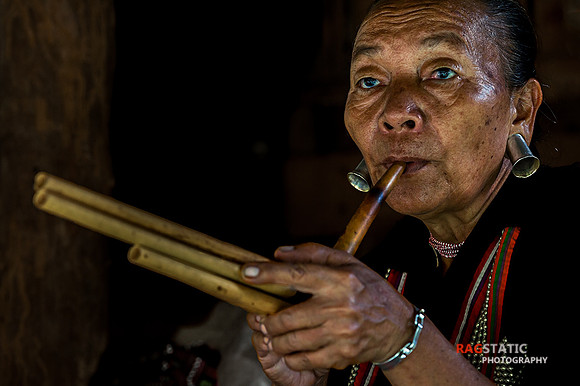 Tribal Lady playing the flute