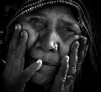 An Old Lady smiles thru her eyes - Many a story to tell